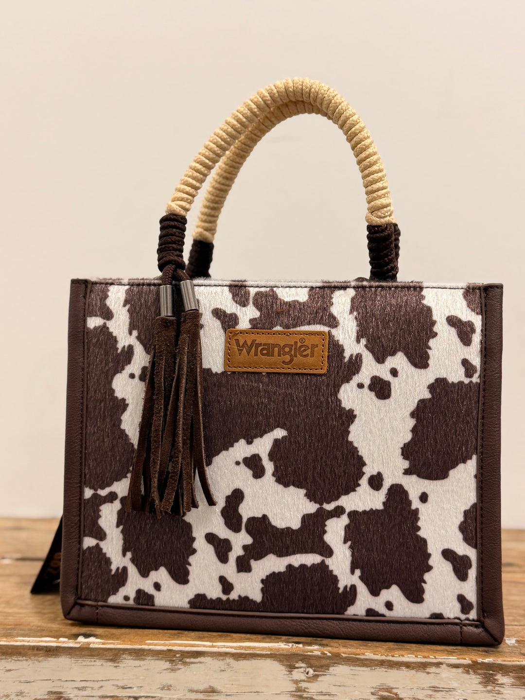 WRANGLER COW PRINT TASSEL CROSSBODY BAG